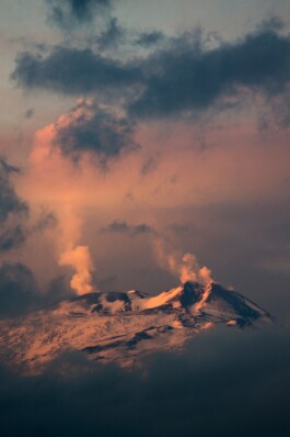Snow and orange light on etna